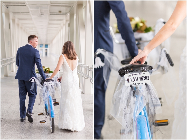 Savanna & Colin's Roanoke wedding with portraits under the magnolia trees at Hotel Roanoke and a reception and newlywed portraits at the Taubman Museum of Art. Wedding party exit photo with the newlyweds on a tandem bike with the bike plate that says Just Married