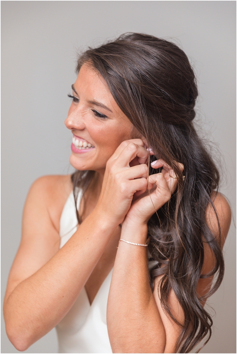 Allie & Cam's autumn riverside Richmond wedding at Celebrations at the Reservoir with a first dance under the lights, forest newlywed portraits, a dessert table, and a signature drink named after their dog.