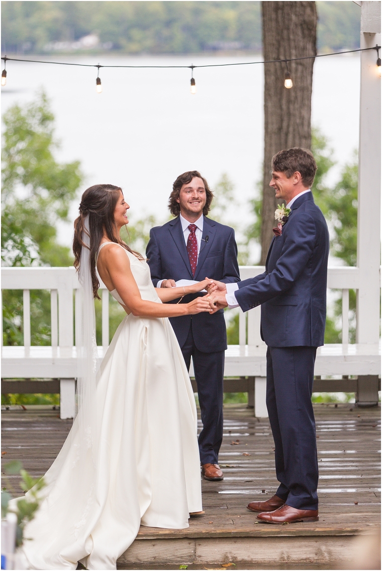 Allie & Cam's autumn riverside Richmond wedding at Celebrations at the Reservoir with a first dance under the lights, forest newlywed portraits, a dessert table, and a signature drink named after their dog.