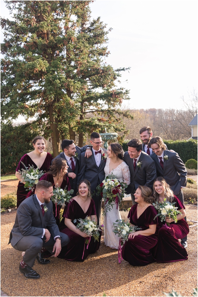 Rachael & Trent's red velvet and white winter wedding at the Inn at Willow Grove with a first look with bridesmaids, first look and letter reading, ceremony in the hidden garden, sunset mountain newlywed portraits, and a fairy light tent reception.