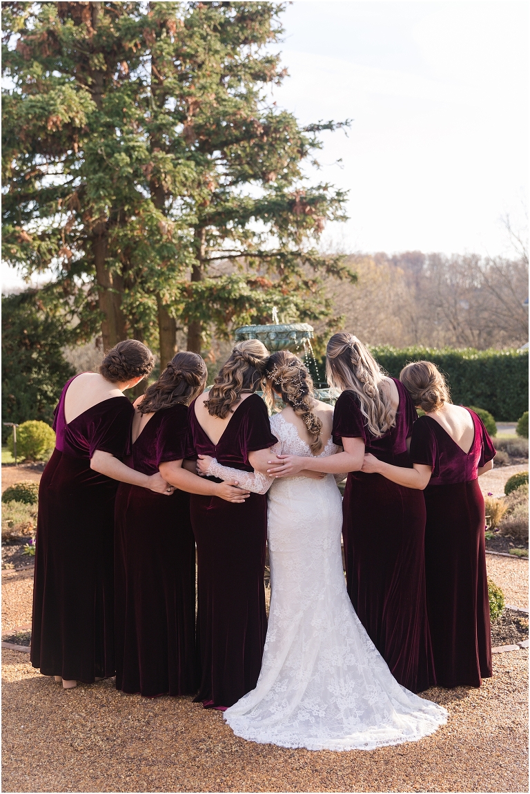 Rachael & Trent's red velvet and white winter wedding at the Inn at Willow Grove with a first look with bridesmaids, first look and letter reading, ceremony in the hidden garden, sunset mountain newlywed portraits, and a fairy light tent reception.