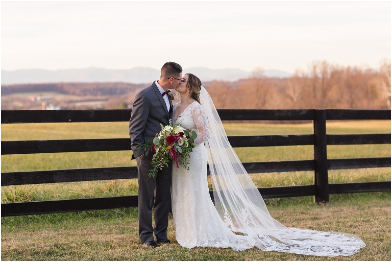 Rachael & Trent's red velvet and white winter wedding at the Inn at Willow Grove with a first look with bridesmaids, first look and letter reading, ceremony in the hidden garden, sunset mountain newlywed portraits, and a fairy light tent reception.