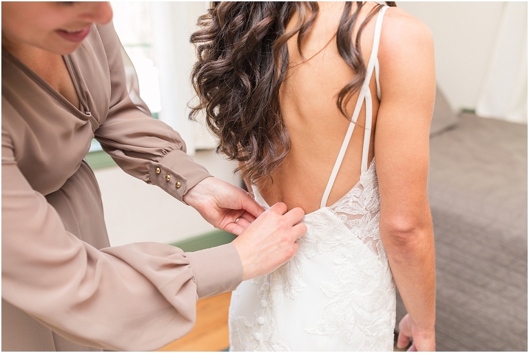 Family farm and barn spring wedding bride with her wedding dress getting ready