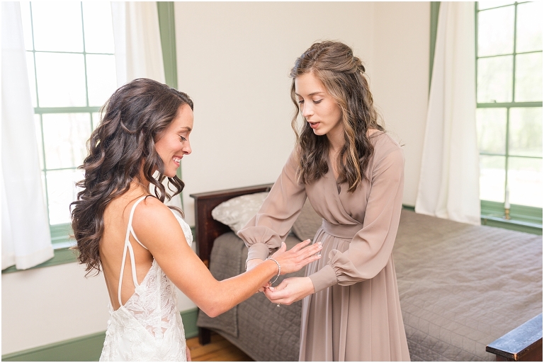 Family farm and barn spring wedding bride with her wedding dress getting ready