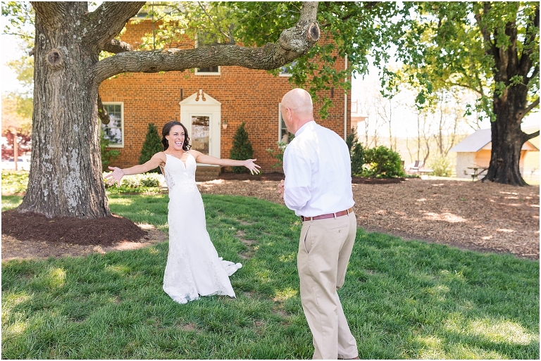 Family farm and barn spring wedding first look with bride's father