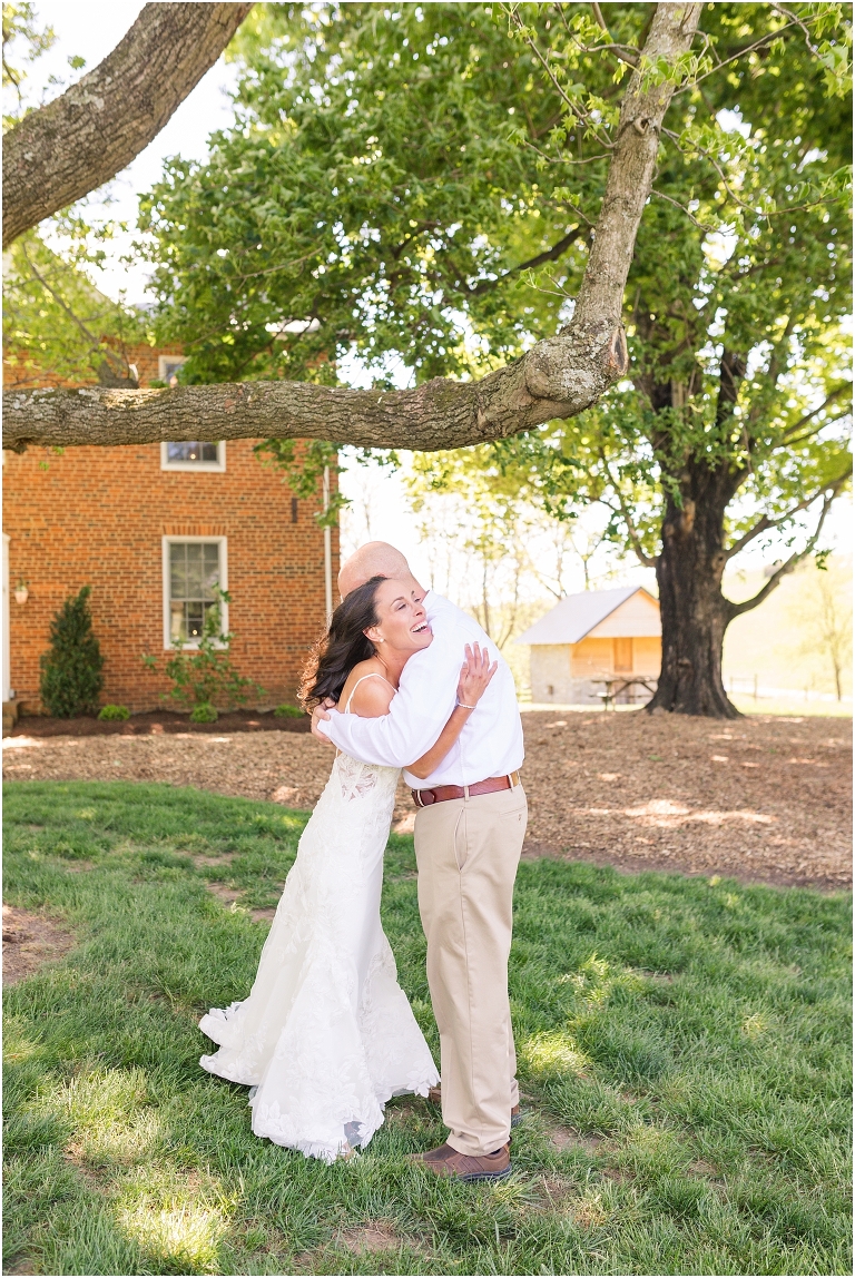 Family farm and barn spring wedding first look with bride's father