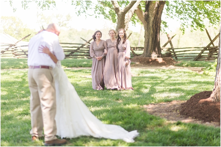Family farm and barn spring wedding first look with bride's father