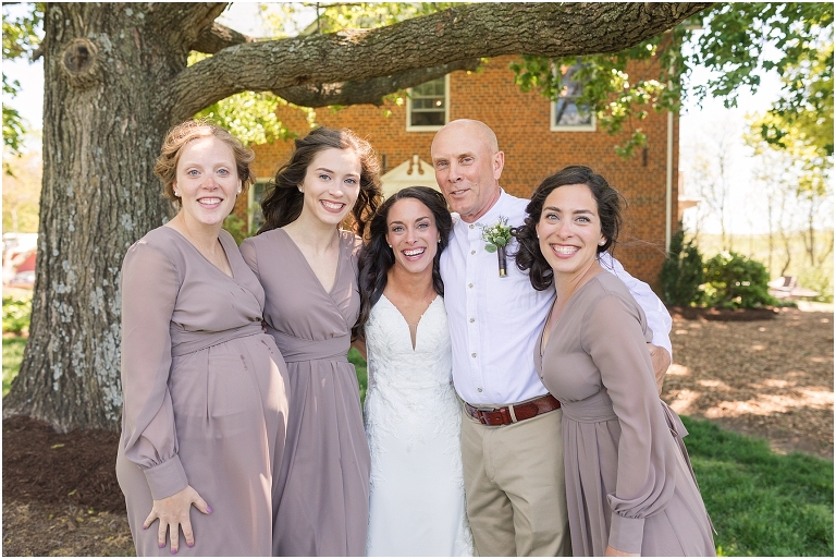 Family farm and barn spring wedding first look with bride's father