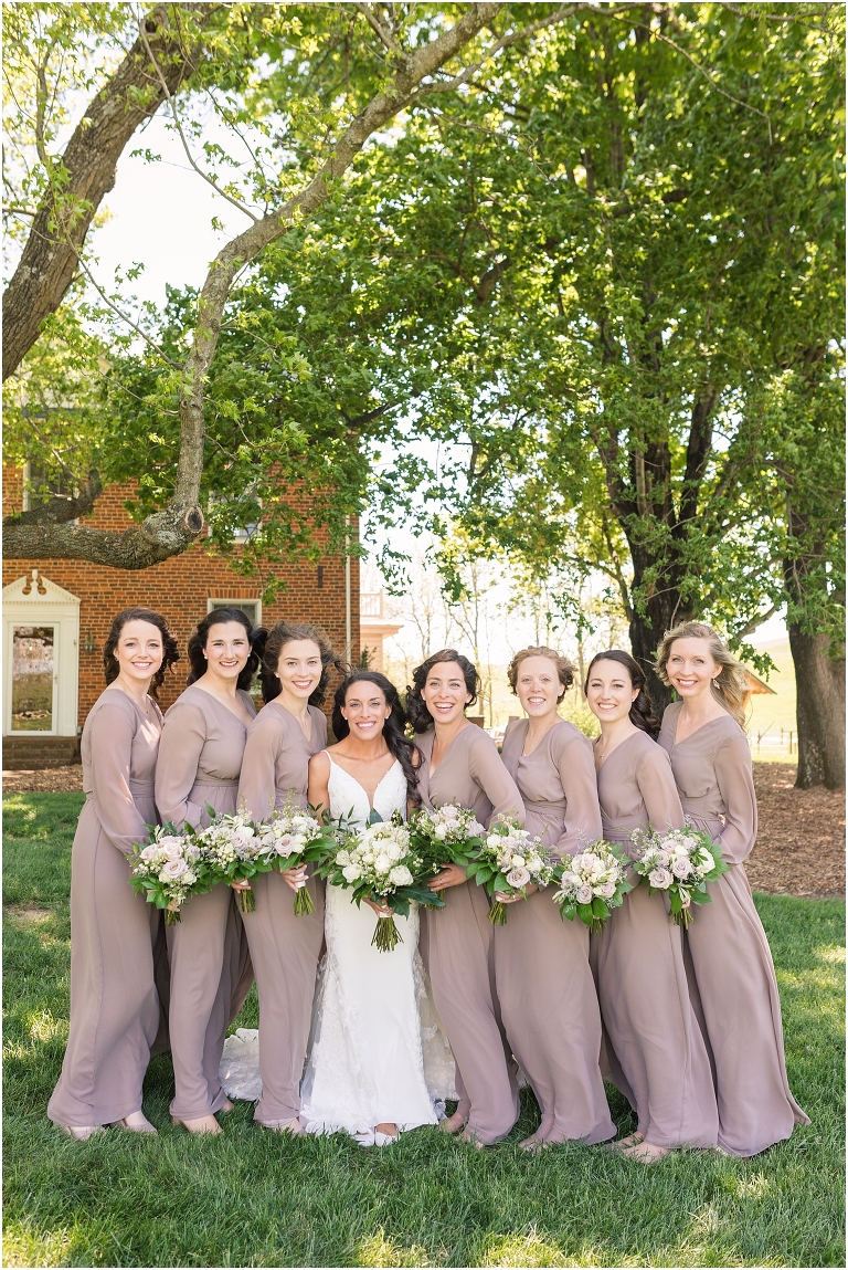 Family farm and barn spring wedding bridesmaid portraits with mauve bridesmaid dresses
