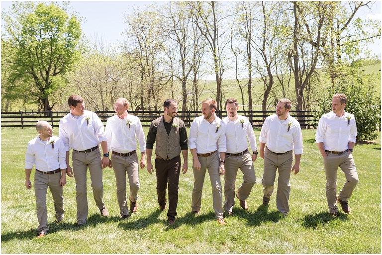 Family farm and barn spring wedding groomsmen portraits