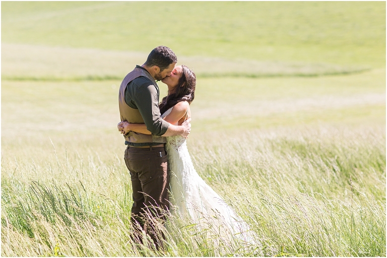 Family farm and barn spring wedding newlywed portraits in an open field