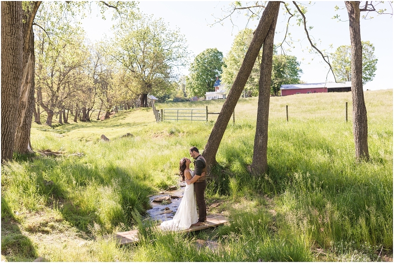 Family farm and barn spring wedding newlywed portraits in a creek
