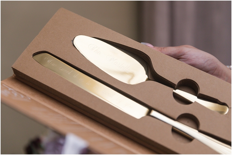 The custom engraved cake cutting set for their wedding cake